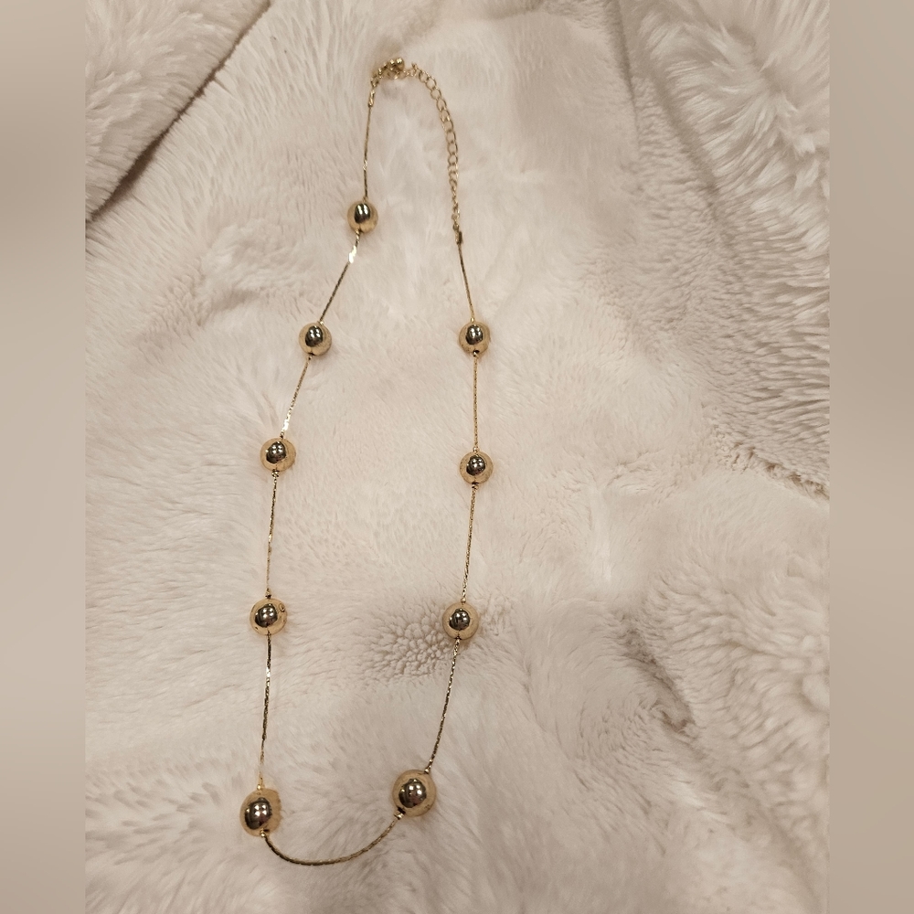 Gold colored necklace